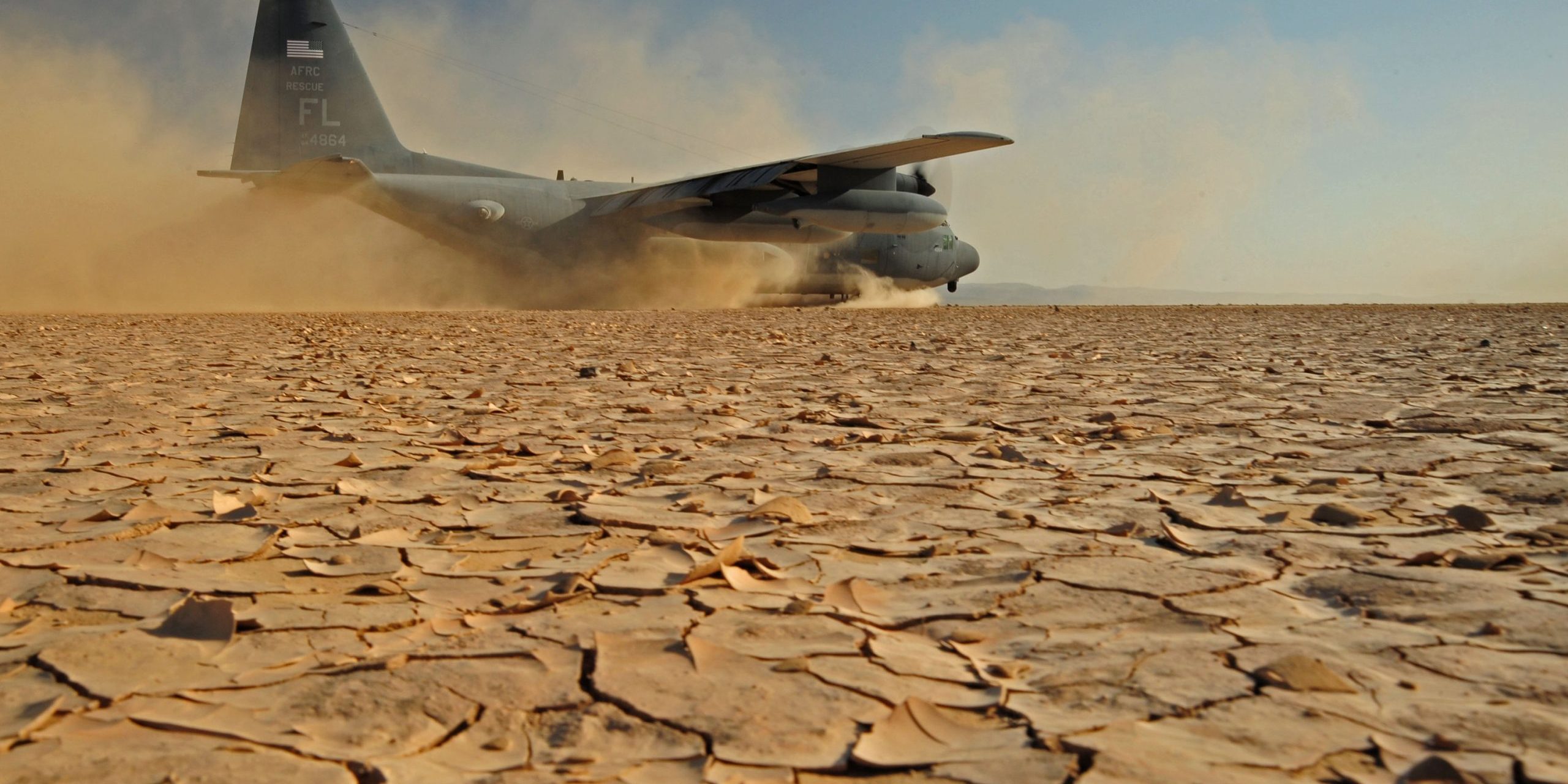 Operation Enduring Freedom Plane lands on dry-cracked land